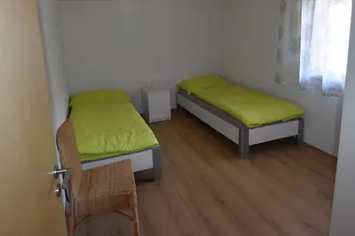 Ein Bett oder Betten in einem Zimmer der Unterkunft Ferienwohnung Gemeindematte