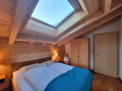 Ein Bett oder Betten in einem Zimmer der Unterkunft Haus Serac