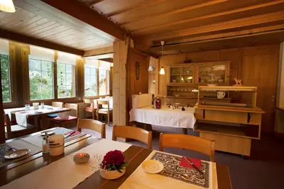 Ein Bett oder Betten in einem Zimmer der Unterkunft Pension Alpina