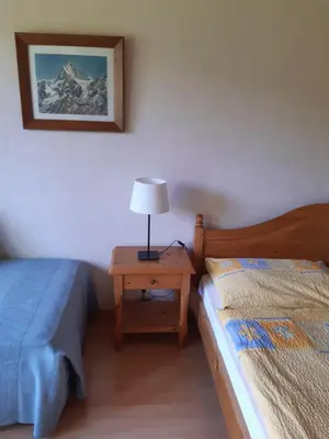 Ein Bett oder Betten in einem Zimmer der Unterkunft Pension Alpina