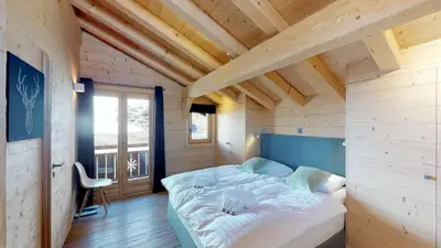 Ein Bett oder Betten in einem Zimmer der Unterkunft Be Cool SAUNA & LUXURY chalet 10 pers by Alpvision Résidences