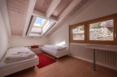 Ein Bett oder Betten in einem Zimmer der Unterkunft Chalet Schneehoren Penthouse