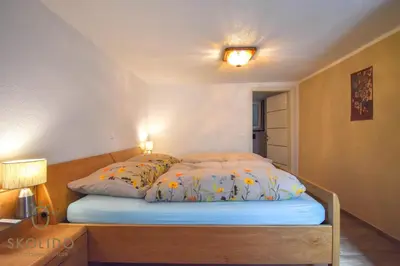 Ein Bett oder Betten in einem Zimmer der Unterkunft Casa Sunegga