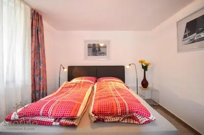 Ein Bett oder Betten in einem Zimmer der Unterkunft Casa Sunegga