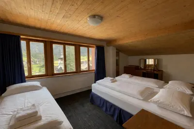 Ein Bett oder Betten in einem Zimmer der Unterkunft Chalet Rosa B&B