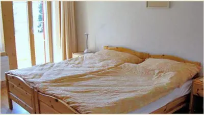 Ein Bett oder Betten in einem Zimmer der Unterkunft Chalet Schönbühl