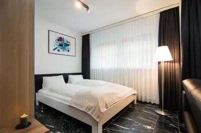 Ein Bett oder Betten in einem Zimmer der Unterkunft Bacchus Saas-Fee