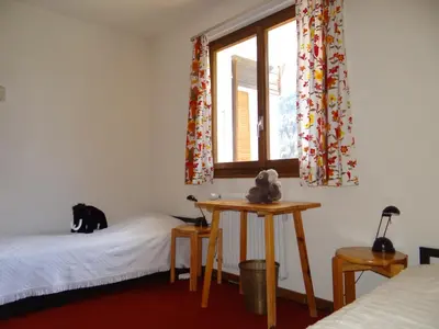 Ein Bett oder Betten in einem Zimmer der Unterkunft Les Arolles