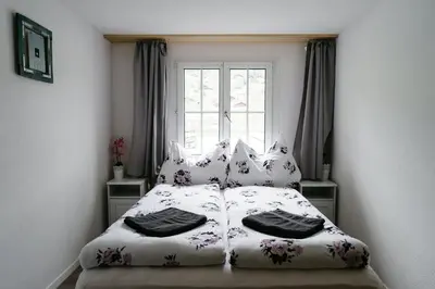 Ein Bett oder Betten in einem Zimmer der Unterkunft Mönch Amazing Apartment Grindelwald