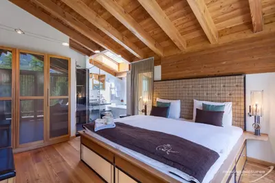 Ein Bett oder Betten in einem Zimmer der Unterkunft Suitenhotel Zurbriggen