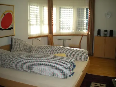 Ein Bett oder Betten in einem Zimmer der Unterkunft Appartementhaus La Promenade