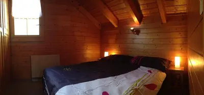 Ein Bett oder Betten in einem Zimmer der Unterkunft L'Eau-Vive