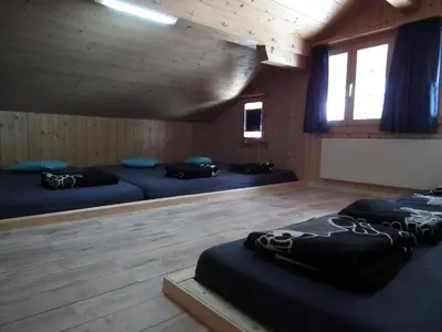 Ein Bett oder Betten in einem Zimmer der Unterkunft Alpenlodge