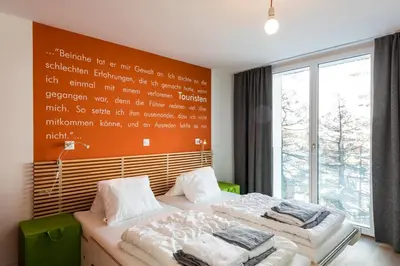 Ein Bett oder Betten in einem Zimmer der Unterkunft Legendär Zermatt