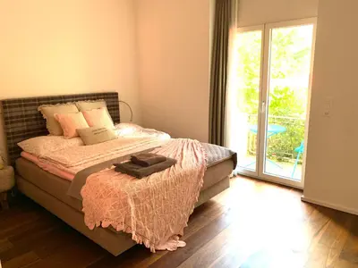 Ein Bett oder Betten in einem Zimmer der Unterkunft Alpine City Suite