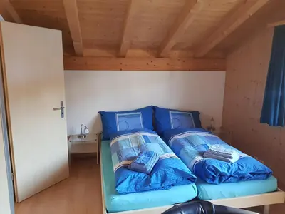 Ein Bett oder Betten in einem Zimmer der Unterkunft Oeystrasse 10a