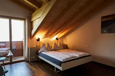 Ein Bett oder Betten in einem Zimmer der Unterkunft Auszeit-Hotel Z Aeschiried