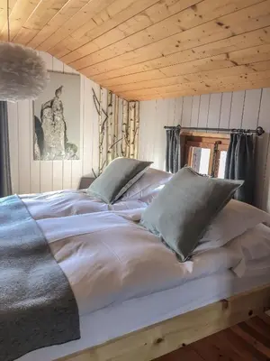 Ein Bett oder Betten in einem Zimmer der Unterkunft Hôtel Le Grand Chalet Favre