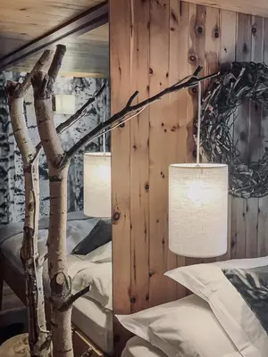 Ein Bett oder Betten in einem Zimmer der Unterkunft Hôtel Le Grand Chalet Favre
