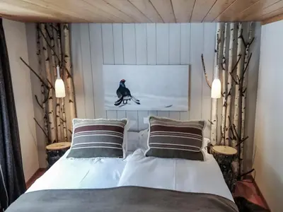 Ein Bett oder Betten in einem Zimmer der Unterkunft Hôtel Le Grand Chalet Favre