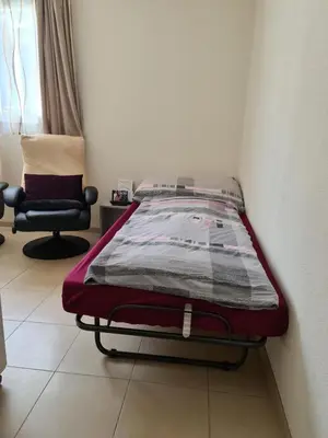 Ein Bett oder Betten in einem Zimmer der Unterkunft Petit Paradisli