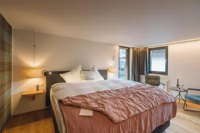 Ein Bett oder Betten in einem Zimmer der Unterkunft Hotel Walliserkanne