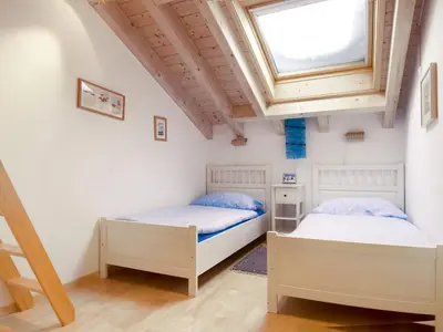 Ein Bett oder Betten in einem Zimmer der Unterkunft Apartment Aquila by Interhome