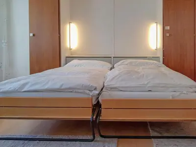 Ein Bett oder Betten in einem Zimmer der Unterkunft Apartment Kondor by Interhome