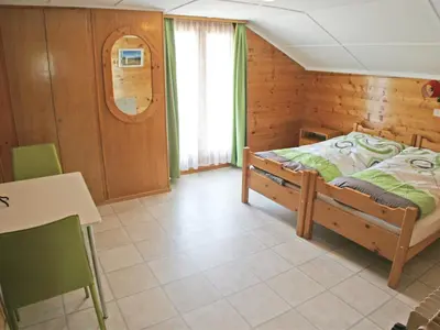 Ein Bett oder Betten in einem Zimmer der Unterkunft Apartment Bergfink Dachgeschoss-1 by Interhome