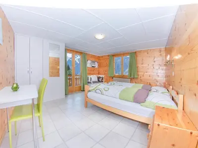 Ein Bett oder Betten in einem Zimmer der Unterkunft Apartment Bergfink Obergeschoss-6 by Interhome