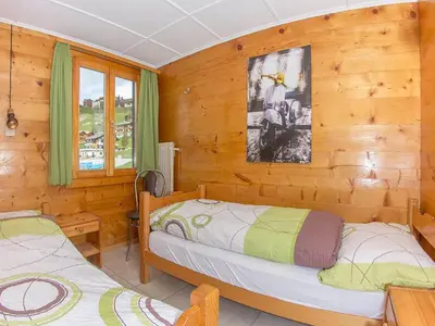Ein Bett oder Betten in einem Zimmer der Unterkunft Apartment Bergfink Obergeschoss-6 by Interhome