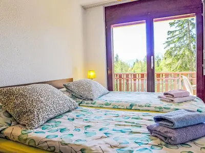 Ein Bett oder Betten in einem Zimmer der Unterkunft Apartment Les Faverges 5 by Interhome