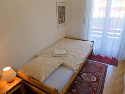 Ein Bett oder Betten in einem Zimmer der Unterkunft Apartment Genziana B 20 by Interhome