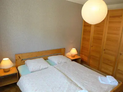 Ein Bett oder Betten in einem Zimmer der Unterkunft Apartment Genziana B 20 by Interhome