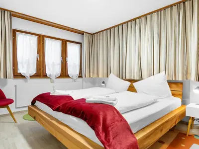 Ein Bett oder Betten in einem Zimmer der Unterkunft Apartment Aragon E112 by Interhome