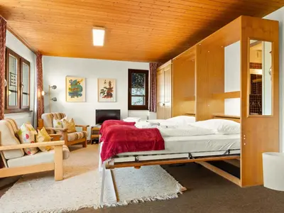 Ein Bett oder Betten in einem Zimmer der Unterkunft Apartment Aragon N103 by Interhome