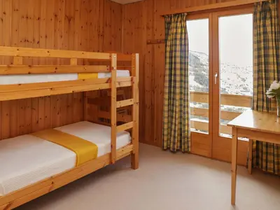 Ein Bett oder Betten in einem Zimmer der Unterkunft Chalet Gamine by Interhome