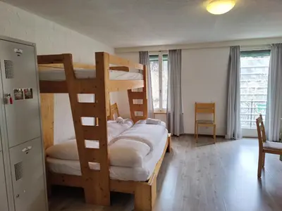 Ein Bett oder Betten in einem Zimmer der Unterkunft Downtown Family&Friends