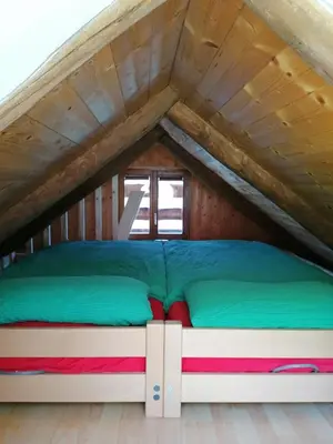 Ein Bett oder Betten in einem Zimmer der Unterkunft Agri Scinghiöra