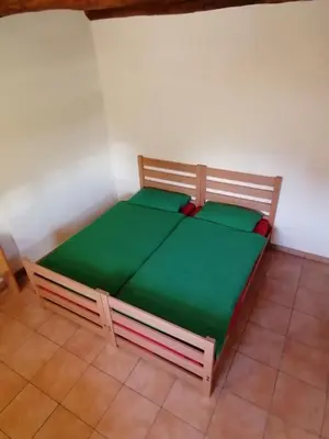 Ein Bett oder Betten in einem Zimmer der Unterkunft Agri Scinghiöra