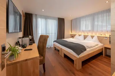 Ein Bett oder Betten in einem Zimmer der Unterkunft Hotel Heimatlodge