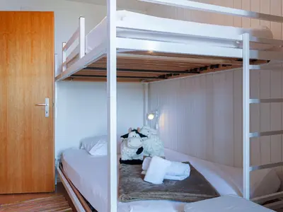 Ein Bett oder Betten in einem Zimmer der Unterkunft Chalet Lao-Lao by Interhome