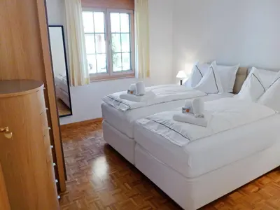 Ein Bett oder Betten in einem Zimmer der Unterkunft Apartment Chalet Perle by Interhome