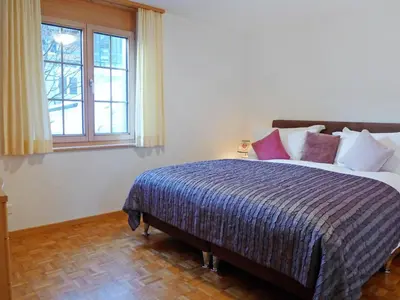 Ein Bett oder Betten in einem Zimmer der Unterkunft Apartment Chalet Perle by Interhome