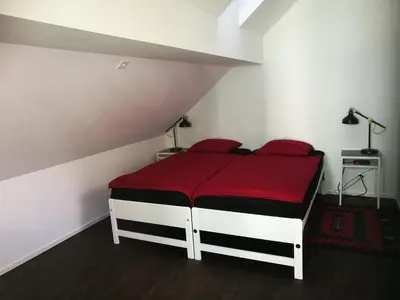 Ein Bett oder Betten in einem Zimmer der Unterkunft Ackaert Ferienwohnung Top of Thun