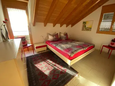 Ein Bett oder Betten in einem Zimmer der Unterkunft Alpenparadies
