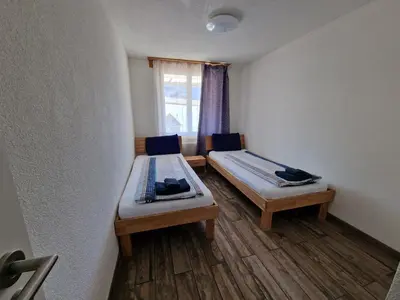 Ein Bett oder Betten in einem Zimmer der Unterkunft Family friendly Apartment in the heart of Interlaken