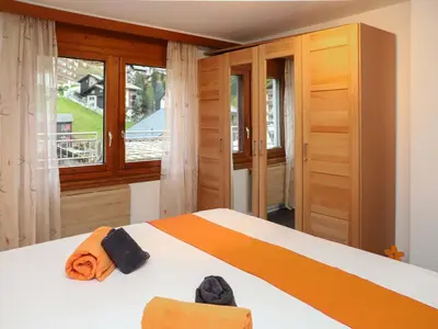 Ein Bett oder Betten in einem Zimmer der Unterkunft Apartment Rossignol B by Interhome