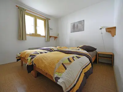Ein Bett oder Betten in einem Zimmer der Unterkunft Apartment in Fieschertal with Swiss Alps Views
