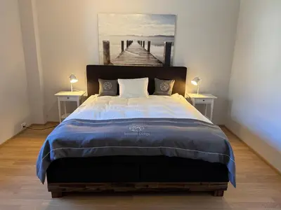Ein Bett oder Betten in einem Zimmer der Unterkunft Seaside-Lodge, Top Apartment